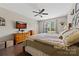 Bright main bedroom featuring a cozy bed, a dresser, and natural light coming through the window at 732 Wood Lily Dr, Belmont, NC 28012