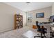 Inviting office space with a large bookshelf and bright window, ideal for work or study at 732 Wood Lily Dr, Belmont, NC 28012