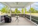 Serene screened porch with scenic views of the landscaped backyard at 732 Wood Lily Dr, Belmont, NC 28012