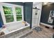 Serene bathroom with a soaking tub, shower, and a view of the green backyard at 8300 Quarters Ln, Mint Hill, NC 28227