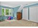 Bright bedroom with large window, neutral carpet, and ample closet space at 8300 Quarters Ln, Mint Hill, NC 28227