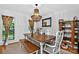 Elegant dining room with stylish chandelier, wood table, and modern decor at 8300 Quarters Ln, Mint Hill, NC 28227