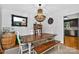 Elegant dining room with stylish chandelier, wood table, and modern decor at 8300 Quarters Ln, Mint Hill, NC 28227
