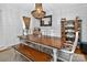 Elegant dining room with stylish chandelier, wood table, and modern decor at 8300 Quarters Ln, Mint Hill, NC 28227