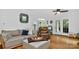 Relaxing living room featuring modern decor, hardwood floors, and a ceiling fan at 8300 Quarters Ln, Mint Hill, NC 28227