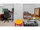 A cluttered office space featuring a desk and chair at 8300 Quarters Ln, Mint Hill, NC 28227
