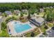 Community pool boasts ample seating, splash pad, grilling, and building for entertainment at 837 Kathy Dianne Dr, Indian Land, SC 29707