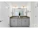 Bathroom with double vanity with granite countertop and grey cabinets at 837 Kathy Dianne Dr, Indian Land, SC 29707