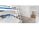 A cozy bedroom showcasing a white bunk bed with built-in desk and ladder, complemented by soft carpeting at 837 Kathy Dianne Dr, Indian Land, SC 29707