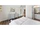 Light-filled bedroom with wood floors and stairs to lower level nearby at 837 Kathy Dianne Dr, Indian Land, SC 29707