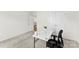 A bright, carpeted room featuring a modern desk, ideal for a home office or study space at 837 Kathy Dianne Dr, Indian Land, SC 29707