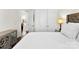 Clean bedroom boasts neutral walls, a tufted headboard, and direct access to more rooms at 837 Kathy Dianne Dr, Indian Land, SC 29707