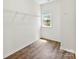 Walk-in closet with a window and wood-style floors offers plenty of storage at 837 Kathy Dianne Dr, Indian Land, SC 29707