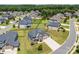 Beautiful two-story home boasting a stone facade, well-manicured lawn, and three car garage at 837 Kathy Dianne Dr, Indian Land, SC 29707