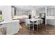 Modern kitchen features gray cabinets, stainless appliances, a center island, and sleek white countertops at 837 Kathy Dianne Dr, Indian Land, SC 29707