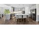 Modern kitchen with grey cabinets, an island with seating, and stainless steel appliances at 837 Kathy Dianne Dr, Indian Land, SC 29707
