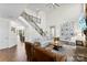 Bright and airy living room with a staircase and view to dining room and kitchen at 837 Kathy Dianne Dr, Indian Land, SC 29707