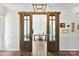 Bright office space with wood sliding doors and a view to the neighborhood in the distance at 837 Kathy Dianne Dr, Indian Land, SC 29707