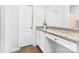 Bathroom featuring granite countertops, white cabinetry, and a vanity area at 8416 Highgate Dr, Charlotte, NC 28215