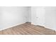 Bright bedroom featuring laminate flooring and a crisp, neutral color palette to create a clean, modern living space at 8416 Highgate Dr, Charlotte, NC 28215