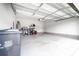 Spacious garage with ample storage space, overhead lighting, and a clean, painted floor at 8416 Highgate Dr, Charlotte, NC 28215