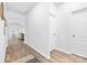 Hallway with wood-look flooring leading to the living area and bedrooms at 8416 Highgate Dr, Charlotte, NC 28215