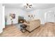 Bright living room with vaulted ceilings, wood-look flooring, and comfortable seating at 8416 Highgate Dr, Charlotte, NC 28215