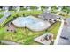 Community pool, playground, and amenities viewed from above, offering resort-style living at 8420 Golden Stone Ln # 138, Fort Mill, SC 29707