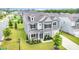 Beautifully landscaped gray home with manicured lawn and a two-car garage at 8420 Golden Stone Ln # 138, Fort Mill, SC 29707