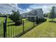 Fenced backyard with green lawn and landscaping that enhances the appeal of this home at 8420 Golden Stone Ln # 138, Fort Mill, SC 29707