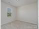 Bedroom featuring a plush carpet, neutral walls and one sunny window at 8420 Golden Stone Ln # 138, Fort Mill, SC 29707