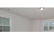 Bright bedroom features two sunny windows, neutral walls, plush carpet and recessed lighting at 8420 Golden Stone Ln # 138, Fort Mill, SC 29707