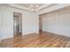 Dining room featuring classic wainscoting, decorative lighting, and luxury vinyl plank flooring at 8420 Golden Stone Ln # 138, Fort Mill, SC 29707