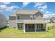 Charming home exterior featuring a screened porch and a spacious backyard at 8420 Golden Stone Ln # 138, Fort Mill, SC 29707