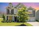 Charming two-story home with gray siding, white trim, and a well-manicured lawn at 8420 Golden Stone Ln # 138, Fort Mill, SC 29707