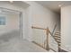 Hallway with stairway and doorway to an open, carpeted room, freshly painted and well-lit at 8420 Golden Stone Ln # 138, Fort Mill, SC 29707