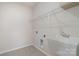 Convenient laundry room with utility sink and wire shelving at 8420 Golden Stone Ln # 138, Fort Mill, SC 29707