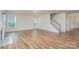 Spacious living room features luxury vinyl plank flooring, a gas fireplace and lots of natural light at 8420 Golden Stone Ln # 138, Fort Mill, SC 29707