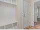 Mudroom featuring built-in storage, a bench, and hooks for organization near the entrance at 8420 Golden Stone Ln # 138, Fort Mill, SC 29707