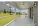 A peaceful screened porch offers serene views of the landscaped backyard and neighborhood at 8420 Golden Stone Ln # 138, Fort Mill, SC 29707
