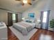Staged bedroom offering hardwood floors, a vaulted ceiling, and modern furnishings at 8904 Daventry Pl, Charlotte, NC 28215