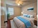Comfortable bedroom with new rug, soothing color tones, and ample natural light at 8904 Daventry Pl, Charlotte, NC 28215