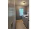Functional laundry room with a window and a washer and dryer at 8904 Daventry Pl, Charlotte, NC 28215