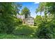 The private backyard is surrounded by mature trees at 904 Edgewood Cir, Gastonia, NC 28052