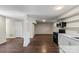 Basement featuring a functional kitchen area, new flooring, and fresh paint at 904 Edgewood Cir, Gastonia, NC 28052