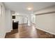 Basement boasting a full kitchen area, new flooring, and fresh paint at 904 Edgewood Cir, Gastonia, NC 28052