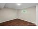 Open basement area featuring new flooring and neutral colors at 904 Edgewood Cir, Gastonia, NC 28052
