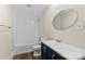 Updated bathroom with a tiled shower/tub and modern vanity with an oval mirror at 904 Edgewood Cir, Gastonia, NC 28052