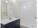 Clean bathroom featuring tiled shower, single sink vanity, and updated fixtures at 904 Edgewood Cir, Gastonia, NC 28052