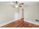 Clean bedroom with hardwood floors, a ceiling fan, and neutral paint, ready for its new owner at 904 Edgewood Cir, Gastonia, NC 28052